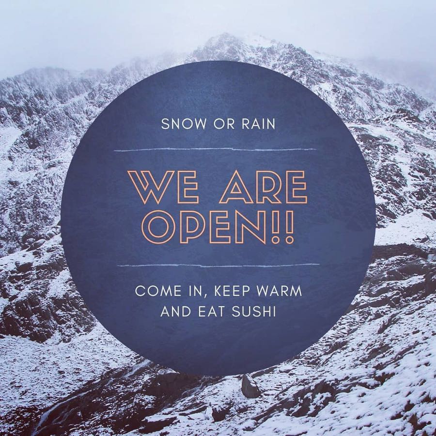 Promotional card over a snowy mountain: "Snow or rain — WE ARE OPEN!! Come in, keep warm and eat sushi."